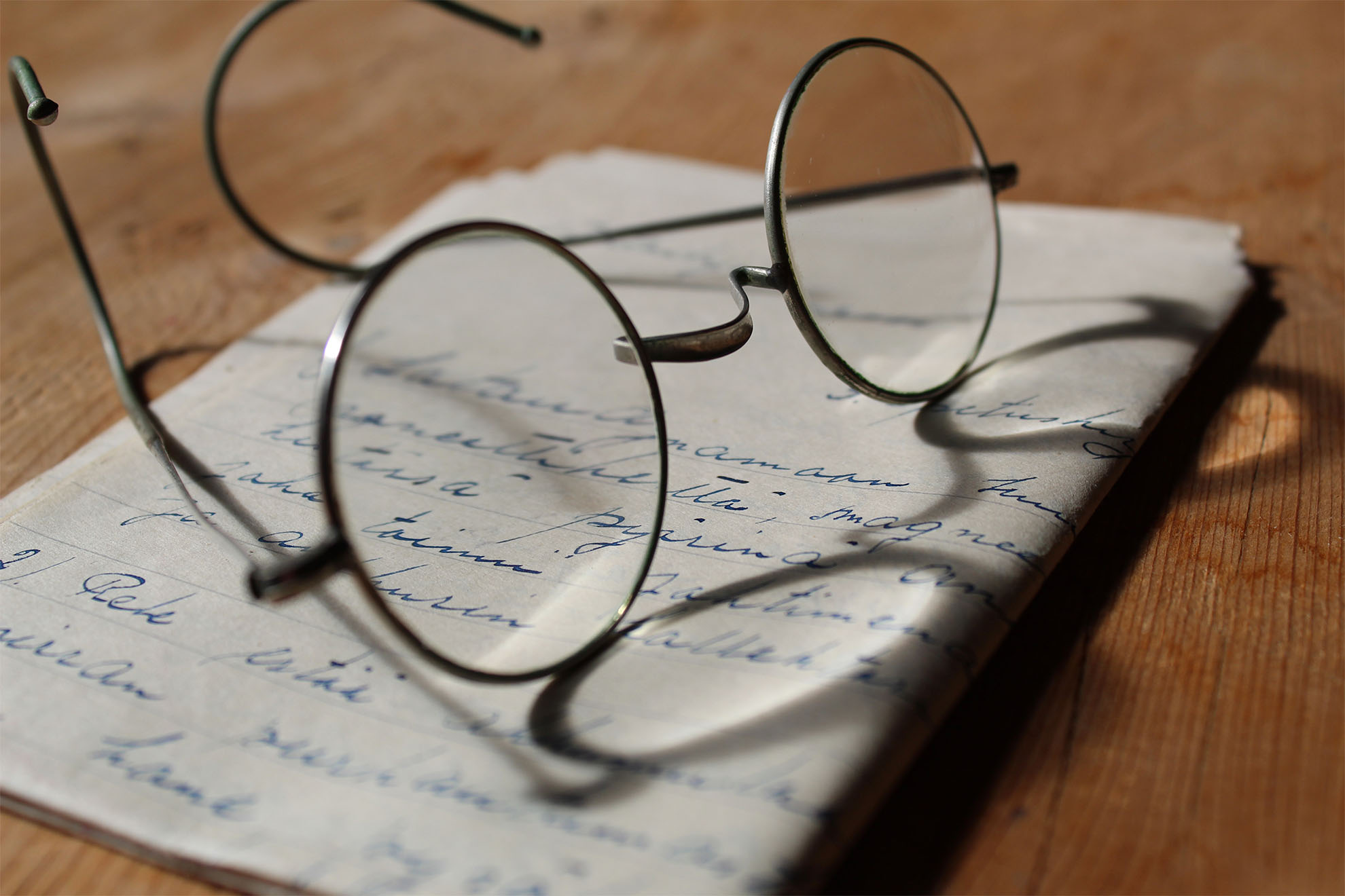 reading glasses on a letter