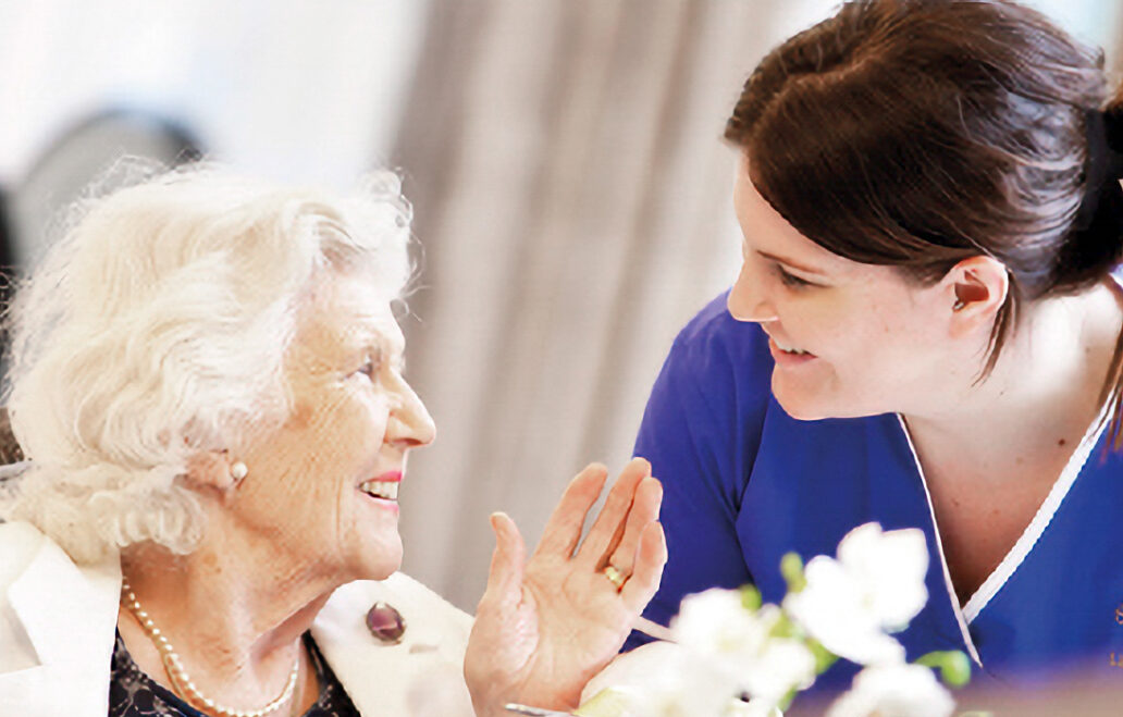 carer speaking with resident
