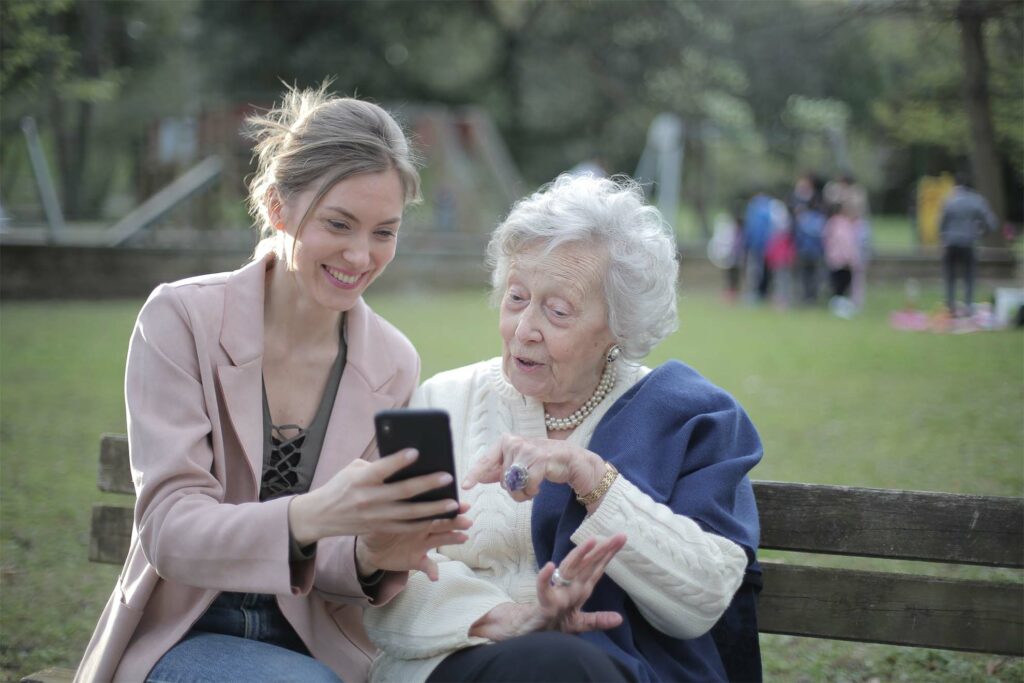 two women looking at phone