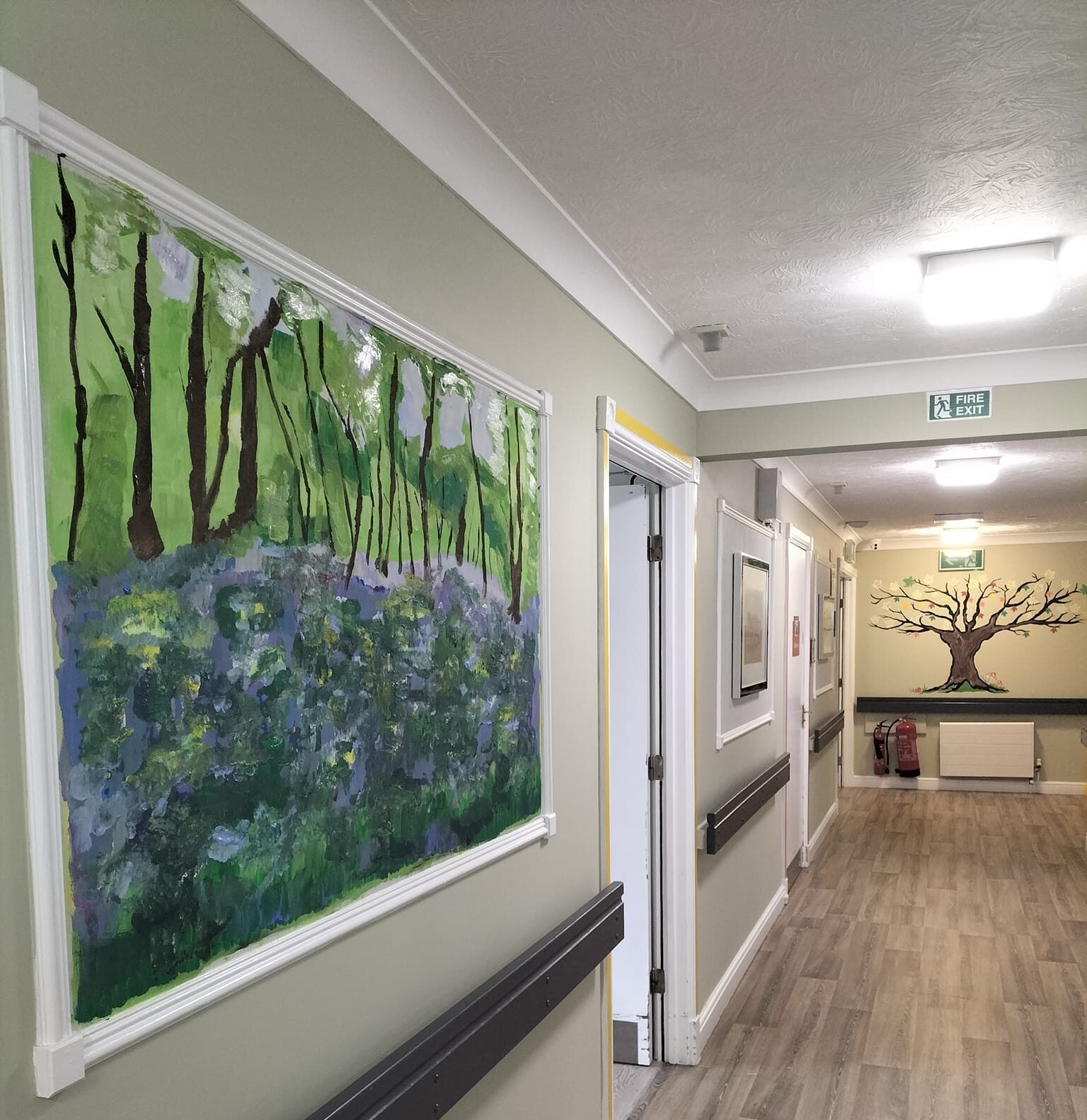 A mural on the walls of a corridor at Hazelwood Care Home