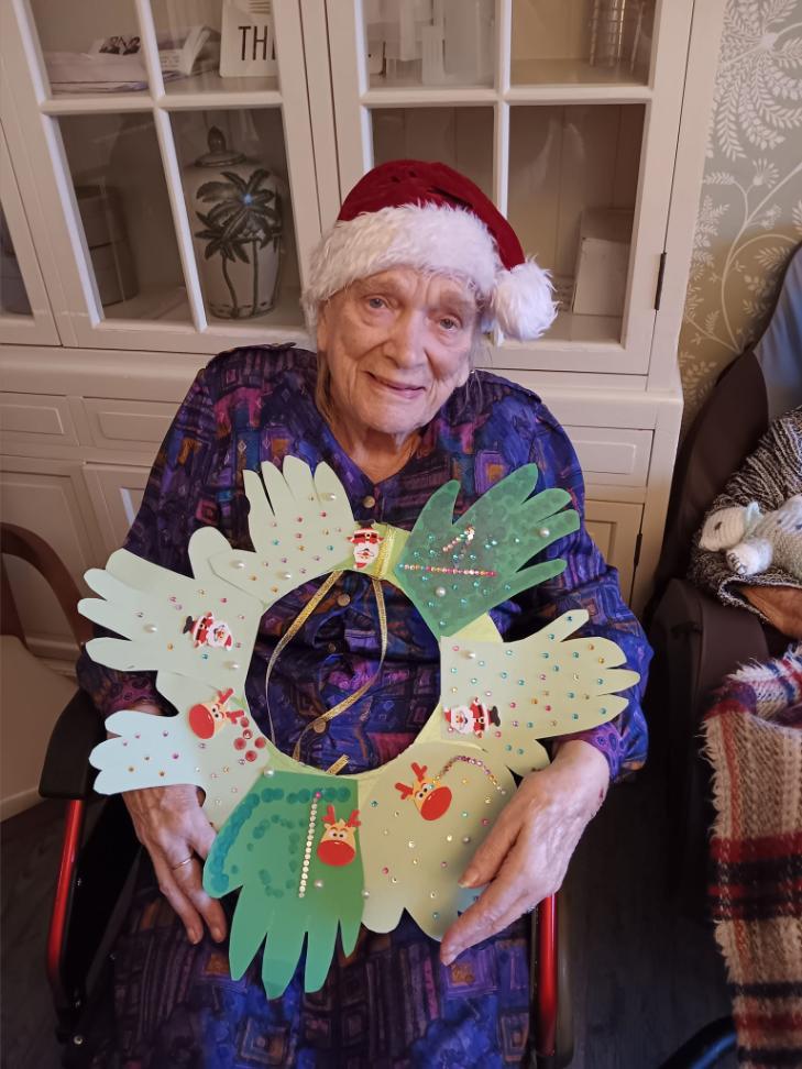resident with her wreath