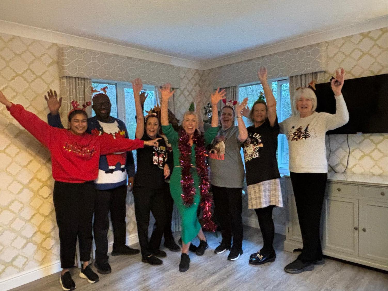 our team with their christmas jumpers on