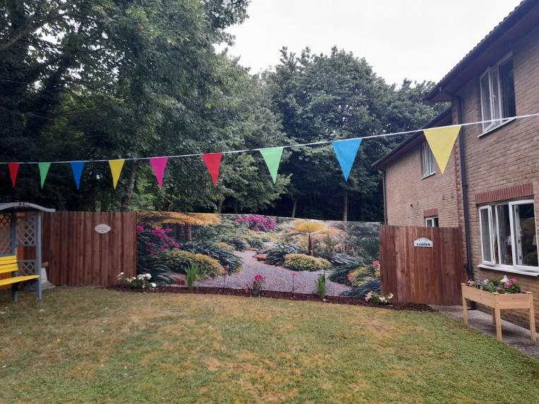 garden fence with a painting on it