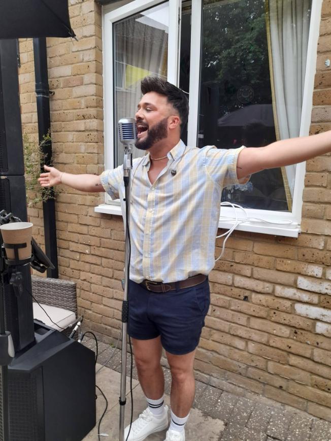 a man singing with a microphone